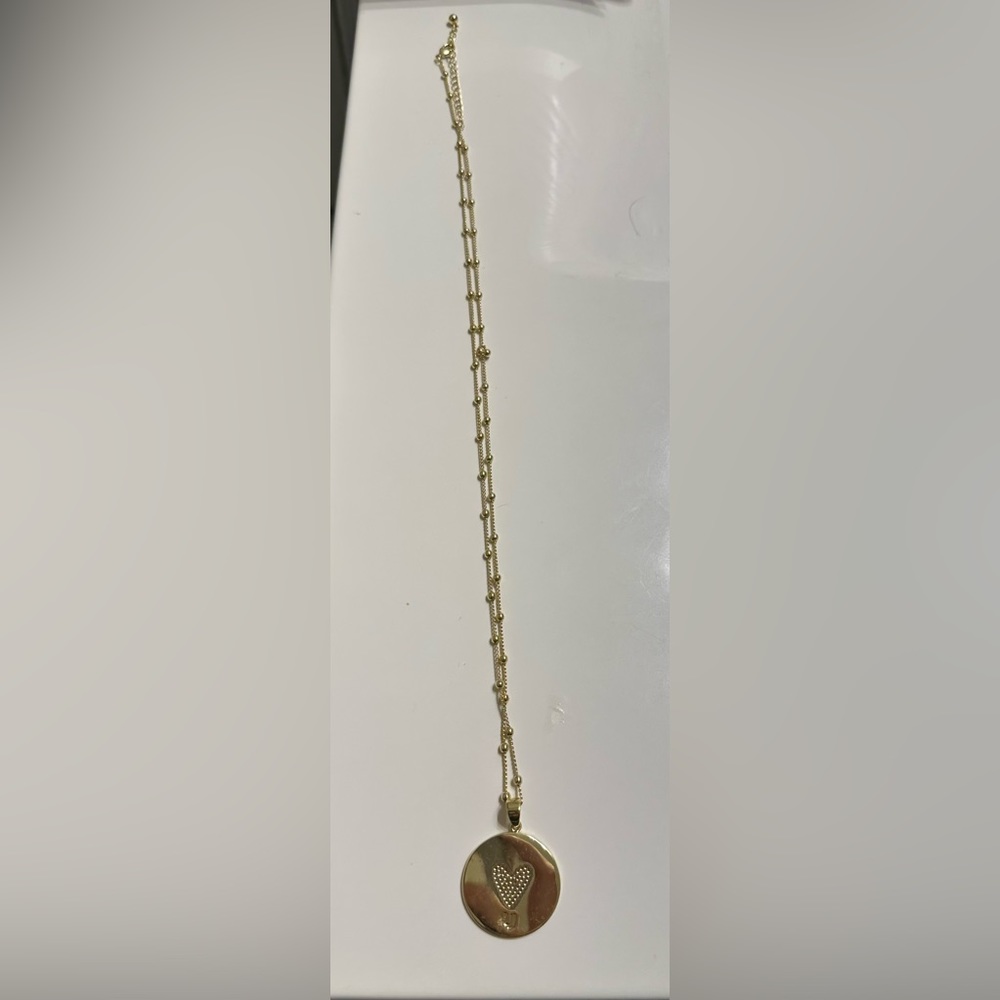 Uncommon James gold starburst pendant